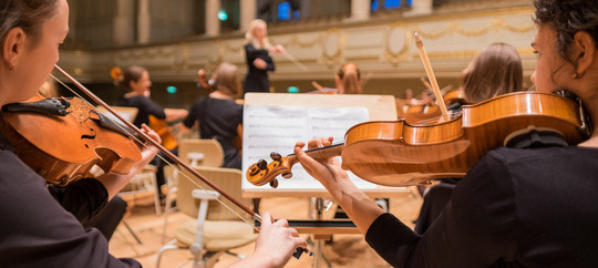 orchestra playing their piece